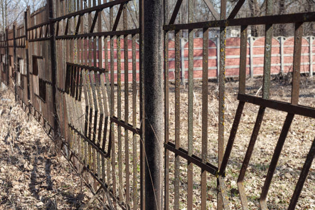 istock old rusty black iron fence. rust and mold are visible on the bars 1352303819