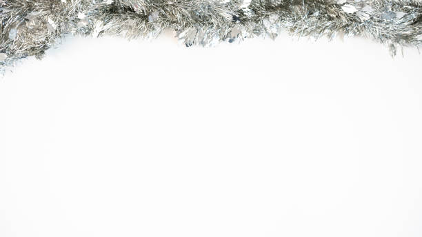 Beautiful silver tinsel christmas traditional decorations in winter with copy space for text.