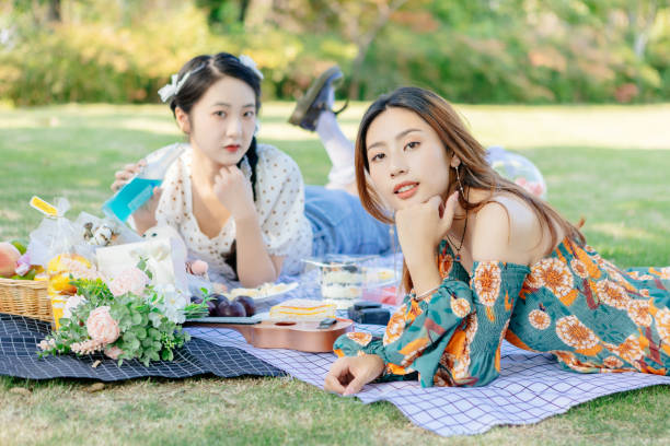 istock The two sisters are having a picnic outdoors. 1352305355