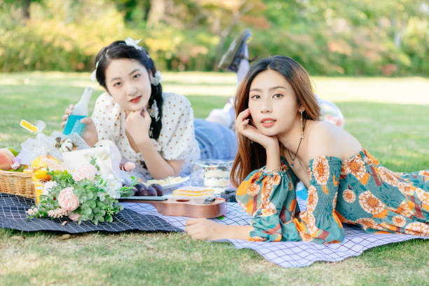 istock The two sisters are having a picnic outdoors. 1352305363