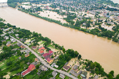 Aerial view of Dnister river with dirty water and  flooded houses in Halych town, western Ukraine.