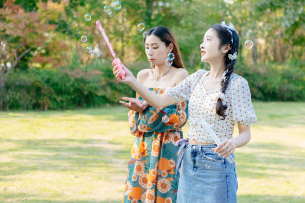 istock The two sisters are having a picnic outdoors. 1352305452