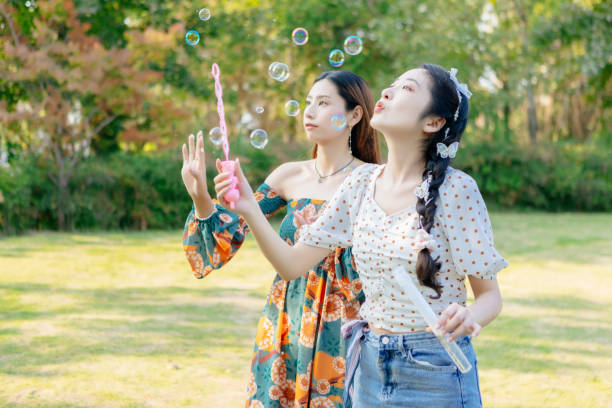 istock The two sisters are having a picnic outdoors. 1352305499