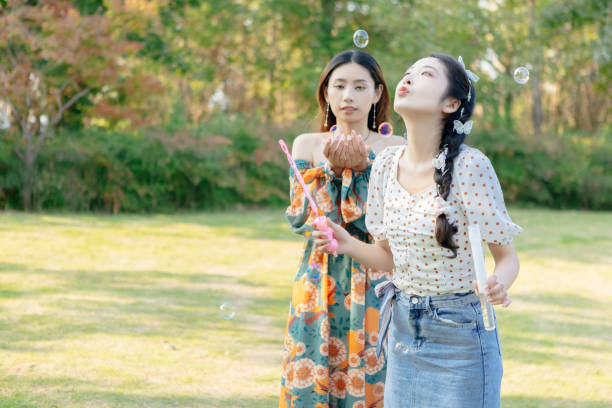 istock The two sisters are having a picnic outdoors. 1352305530