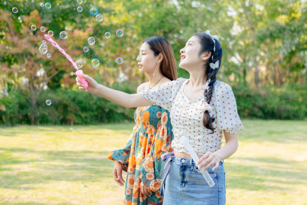 istock The two sisters are having a picnic outdoors. 1352305533