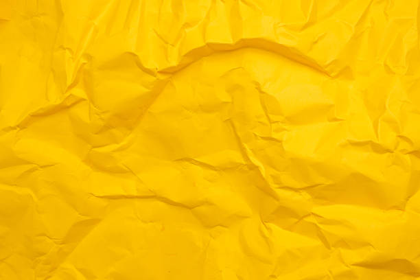 istock Yellow paper texture background. Crumpled paper abstract shape background with space paper for text. Crush paper 1352306339