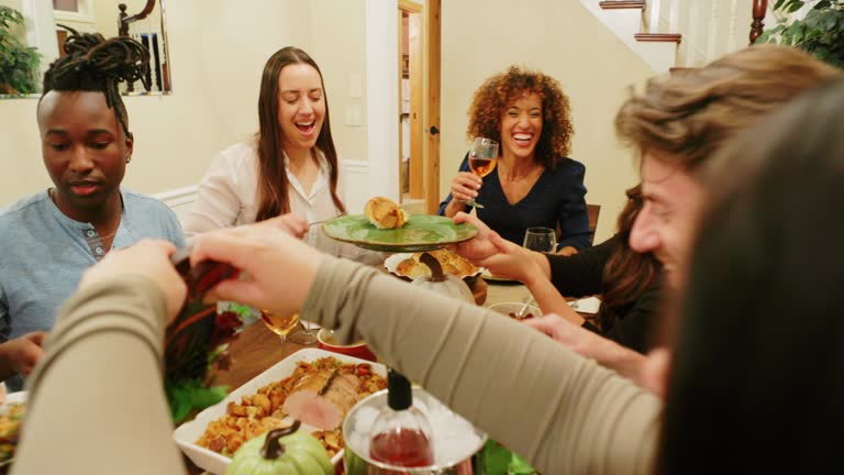 A group of friends celebrating Thanksgiving together with a Friensdsgiving.