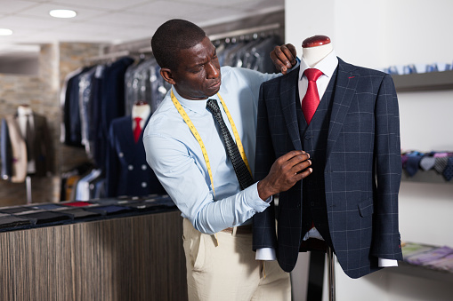 Person is creating business image with red tie in store