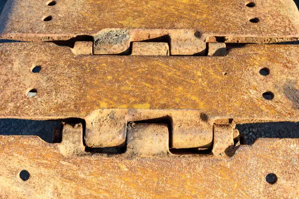 Rusted steel continuous tracks. Close up