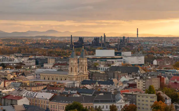 A picture of Ostrava at sunset, showing the Cathedral of the Divine Saviour, the Forum Nová Karolina mall, and Lower Vítkovice in the distance.