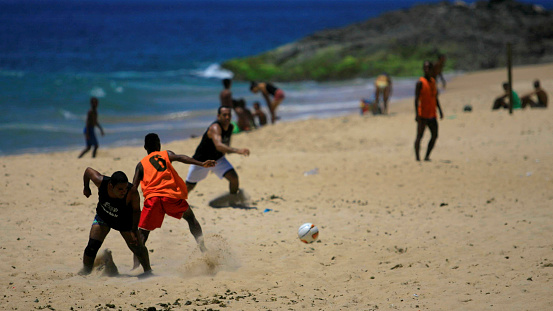 salvador, bahia / brazil - december 29, 2013: people are seen playing football on Amaralina beach in the city of Salvador.