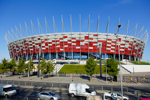 Warsaw, Poland - October 02, 2014: The National Stadium officially opened on January 29, 2012 build for Euro 2012 football competition in Warsaw in Poland . Warsaw is a city that was almost entirely rebuilt after the huge destruction that took place during World War II. Today Warsaw is one of the most dynamically developing metropolitan cities in Europe. Warsaw is also an important cultural, political and economic hub.