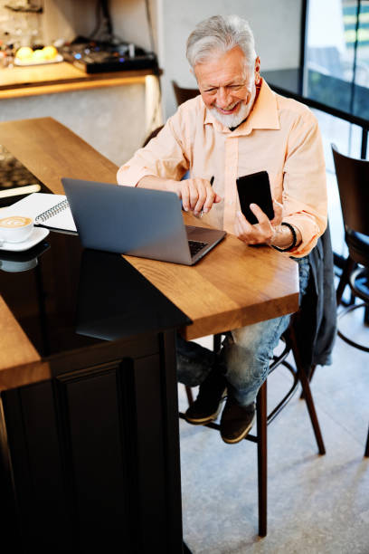 istock A smiling temporary senior student sitting in a cafe and having a video call in pause. Senior student study in the cafe. 1352311178