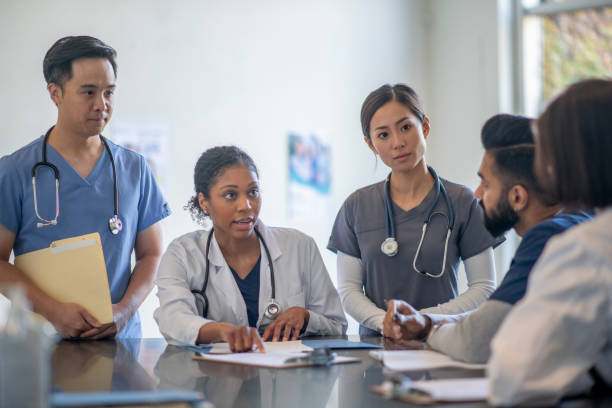 istock Medical Staff Discussing a Patients Test Results 1352311782