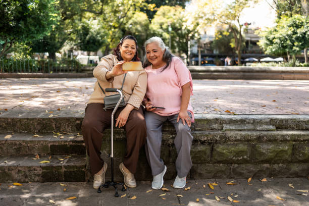 istock Two senior women taking selfie with mobile phone 1352314739