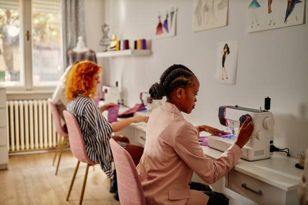 istock Multiracial factory workers sewing in studio 1352315002