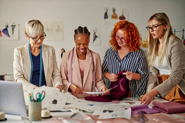 istock Creative people working together in fashion designer studio 1352315700