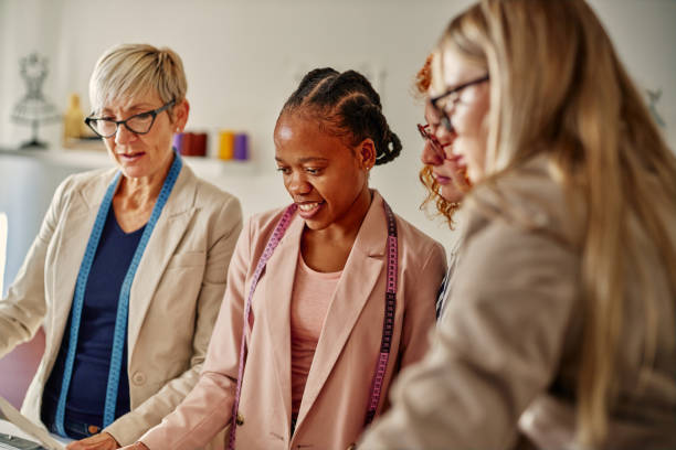 istock Four fashion designers at work 1352315785