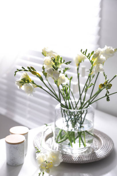 istock Beautiful spring freesia flowers on table in room 1352318385