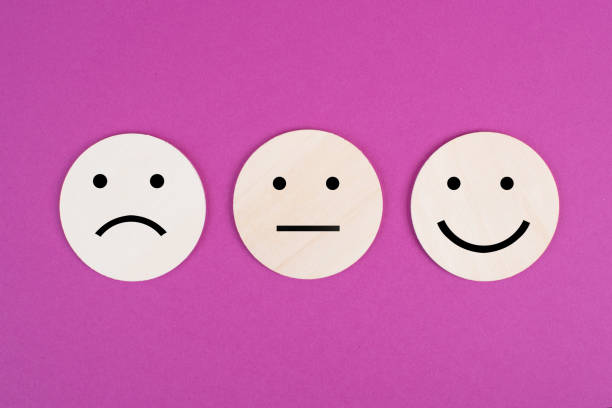 Faces with different emotions, sad, happy,business rating, pink background Faces with different emotions, sad, happy,business rating, pink background emotional series stock pictures, royalty-free photos & images