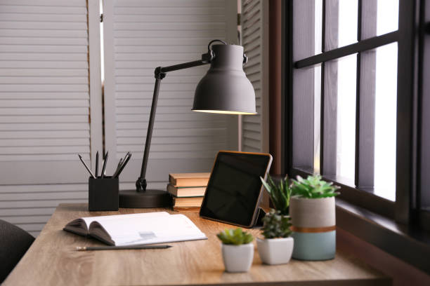 istock Stylish room interior with comfortable workplace near window 1352319400