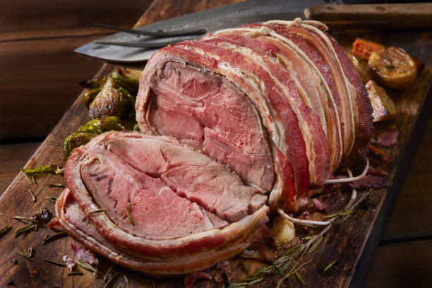 istock Medium Rare, Bacon Wrapped Pork Roast Dinner 1352319550