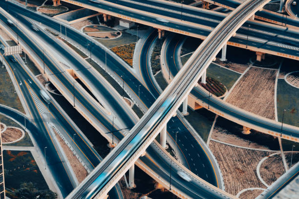 istock Metro Train and Highway intersection in Dubai, UAE 1352319583