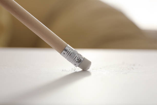 istock Correcting picture on paper with pencil eraser, closeup view 1352320707