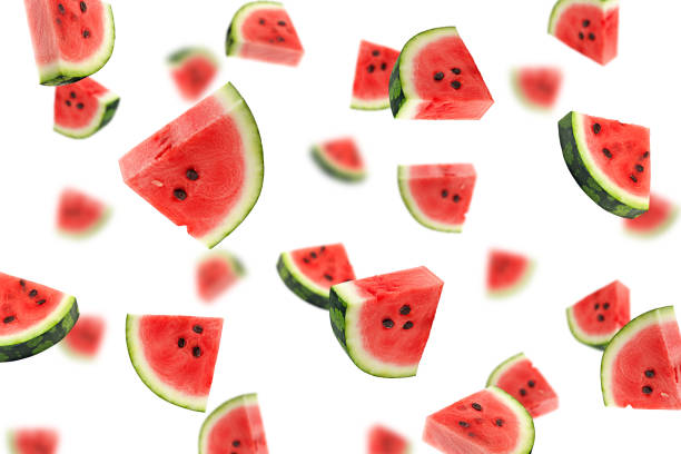 Falling watermelon isolated on white background, selective focus Falling watermelon isolated on white background, selective focus levitation stock pictures, royalty-free photos & images