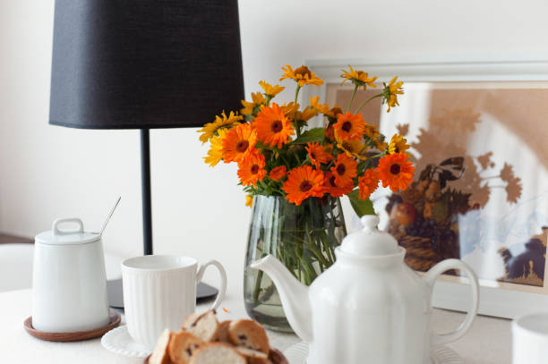 istock Table serving for morning fresh tea with tablecloth and flowers 1352321709