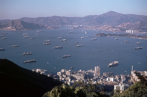 Victoria Harbor, British Hong Kong, China, 1972. The bay in front of Hong Kong with cargo ships from all over the world.