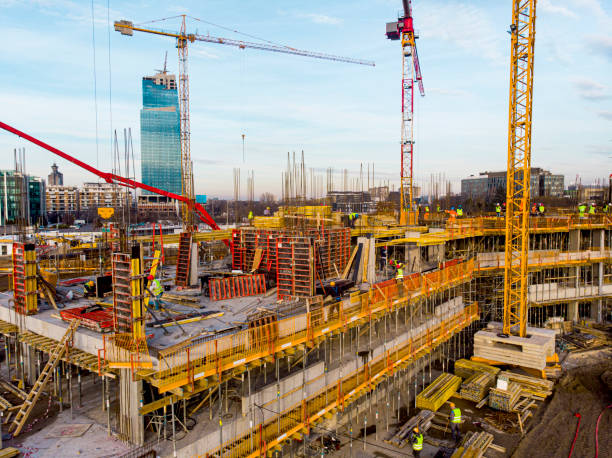 istock High angle view of workers in construction site stock photo 1352330616