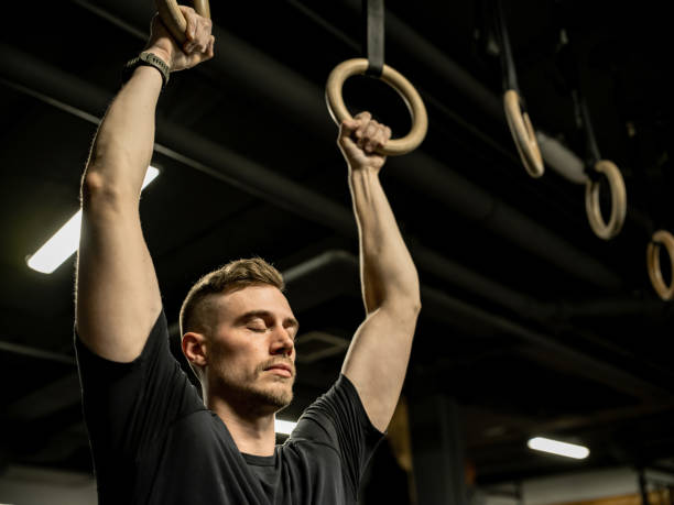 istock Man exercising in the Gym 1352333206