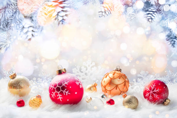 istock Christmas Balls On White - Ornaments In Abstract Defocused Background 1352334369