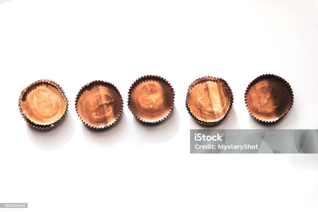 Peanut butter filled candy with chocolate frosting isolated on white background Cup Stock Photo