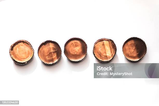 Peanut Butter Filled Candy With Chocolate Frosting Isolated On White Background Stock Photo - Download Image Now