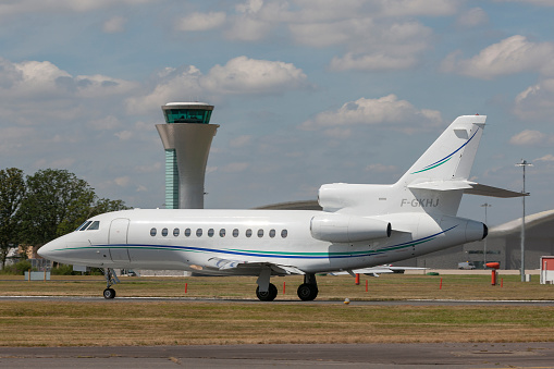 Farnborough, UK - July 17, 2014:  \nDassault Falcon 900 Business Aircraft F-GKHJ taxiing at Farnborough Airport.