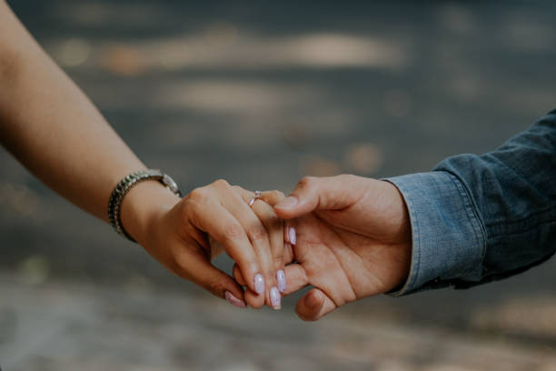 istock Bride and groom holding hands 1352334762