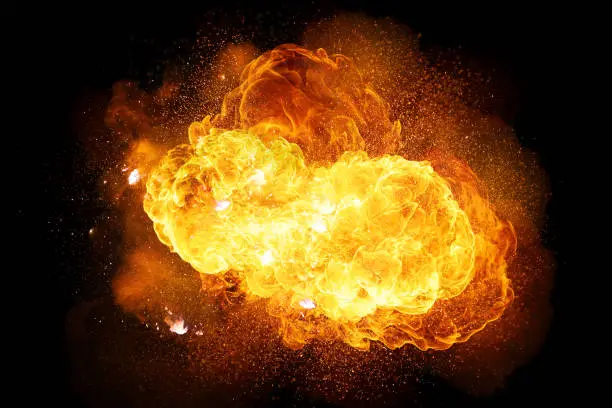 Photo of Realistic fiery explosion with sparks and smoke isolated on black background