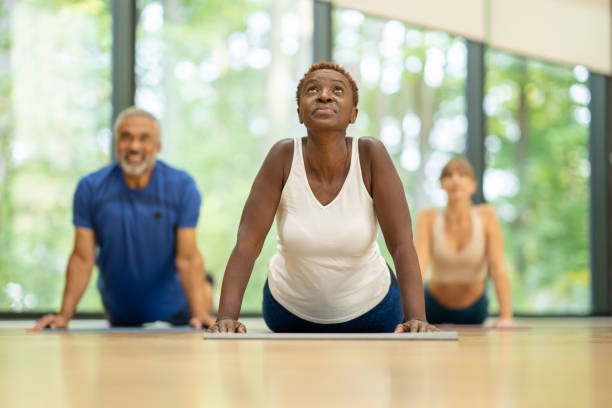 istock Adults Stretching During a Fitness Class 1352339039
