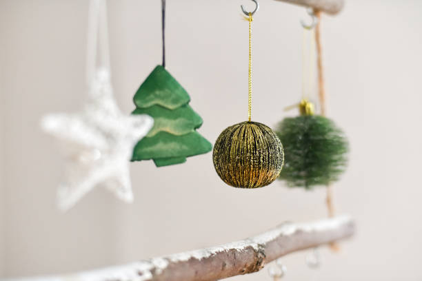 istock Handmade wooden Christmas tree hanging on the wall 1352339981