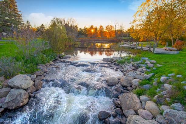 istock Waterfall on the AuSable River in fall-Grayling Michigan 1352341228