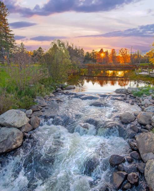 istock Waterfall on the AuSable River in fall-Grayling Michigan 1352341229