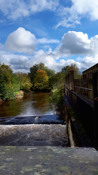 istock The River Calder from the bridge across it in Padiham Town Centre.This river powered 20 cotton weaving Mills in 1906. None now remain in this use 1352341250