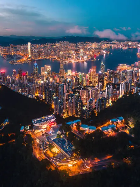 Photo of Aerial View of Hong Kong City and Victoria Harbour at sunset