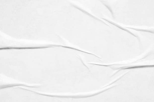 istock white crumpled and creased paper poster texture background 1352345454
