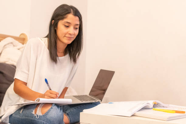 istock Young Adult Women Working on her Education 1352349712