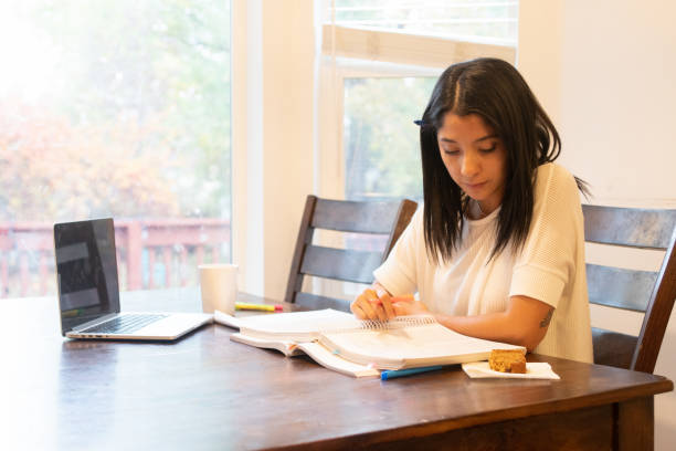 istock Young Adult Women Working on her Education 1352349726