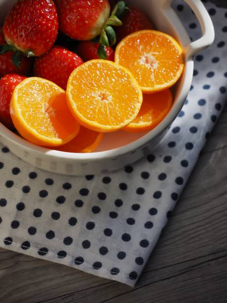 Plate with oranges and strawberry