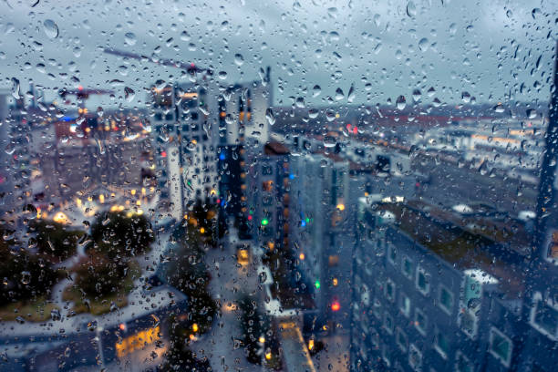istock Raindrops on a glass window pane in focus 1352357883